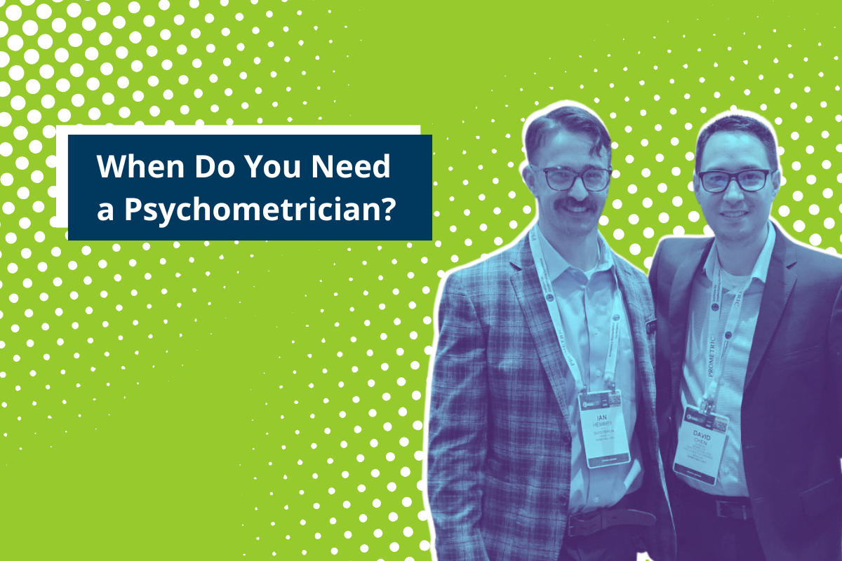 Two Quadterion psychometricians pose together and smile to illustrate when psychometricians are needed during certification program development.